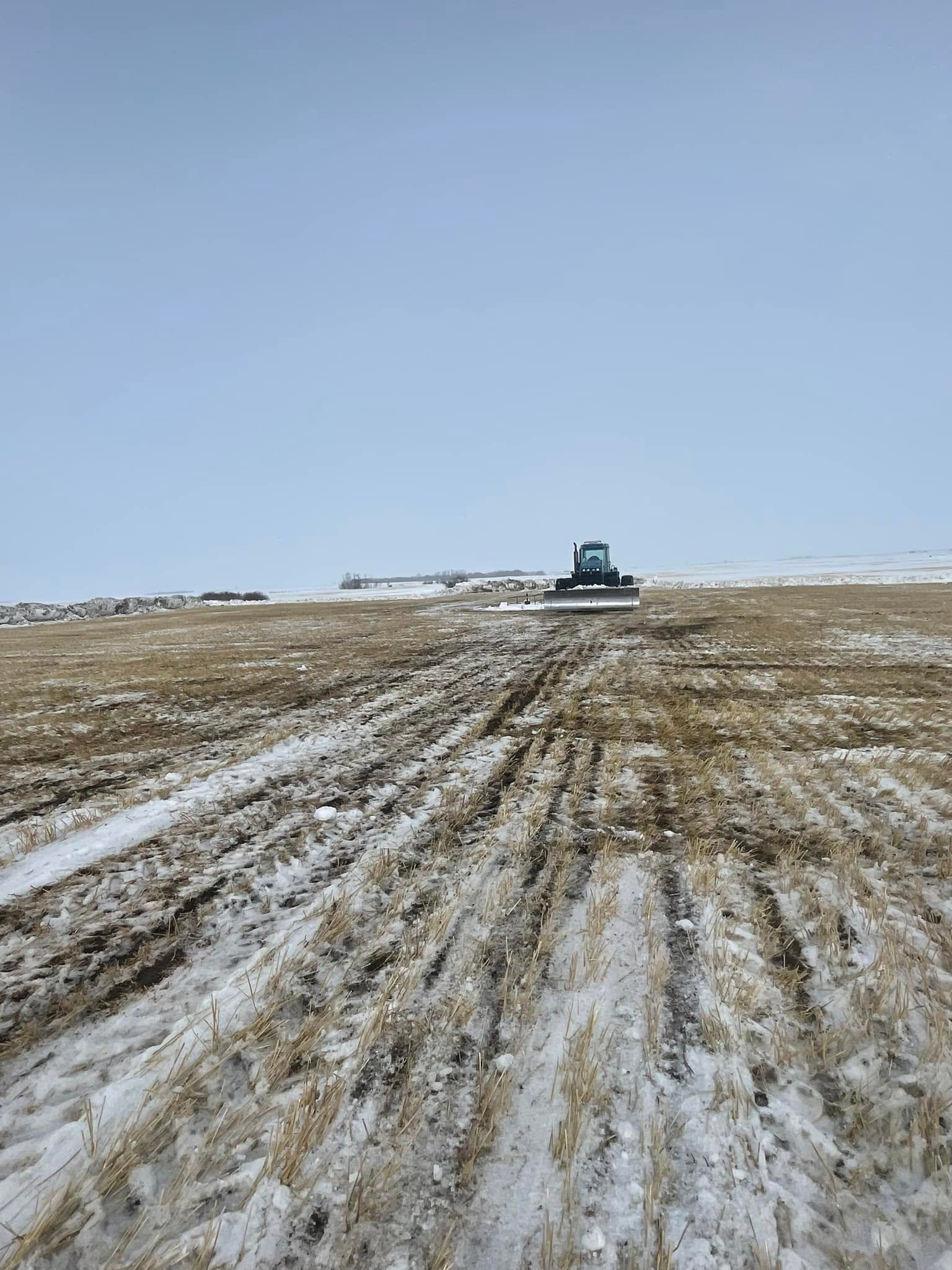 Backhoe service at an oilfield worksite